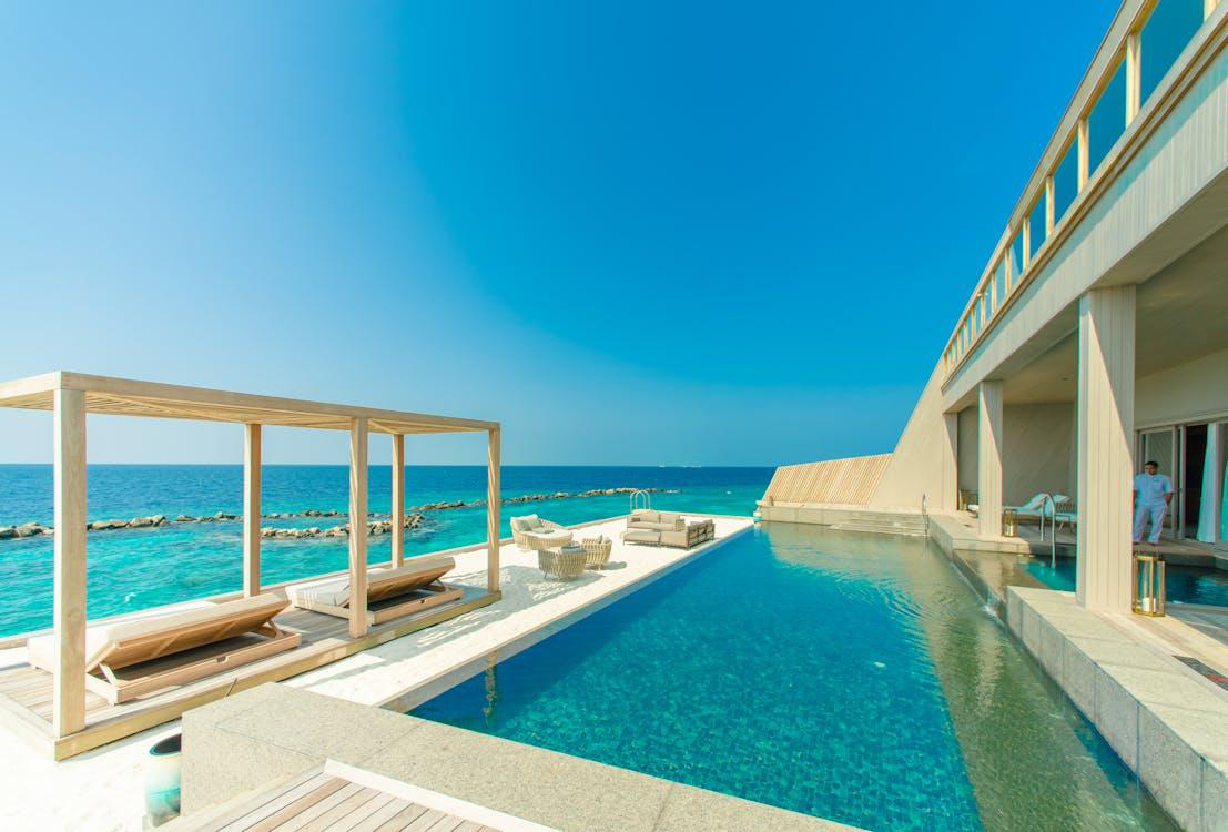 Hotel swimming pool and outdoor lounge area.